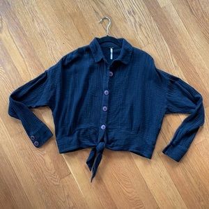 Cropped button down tie front shirt. Textured, soft black cotton by Free People.